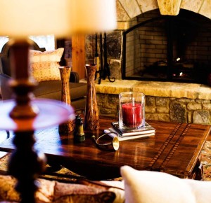 Modern log cabin fireplace with coffee table