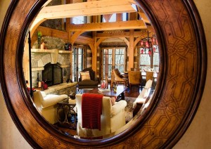 Mirror detail with living room reflection of one of our log house plans
