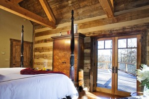 Bedroom and patio in our log house plan