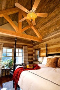 Bedroom with lofted ceiling in one of our log house plans